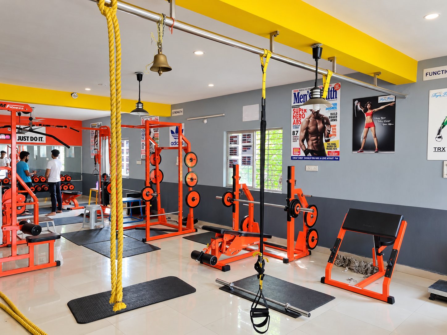 The Fit Hero gym floor in Ujjain with orange CrossFit rig, battle ropes and functional area